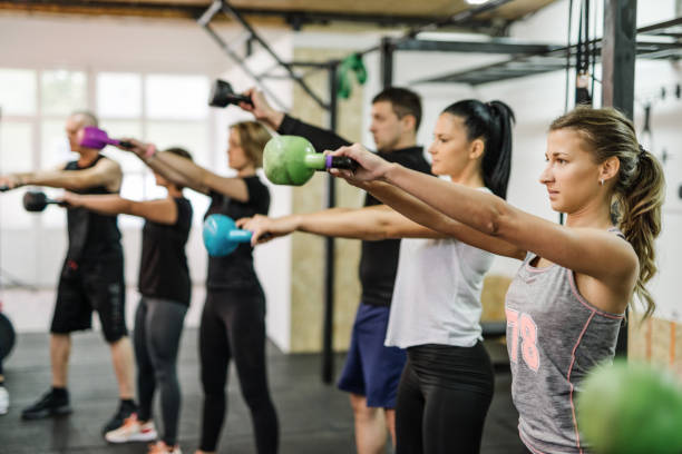 istock Exercising in diverse team with professional fitness instructor 1088368508