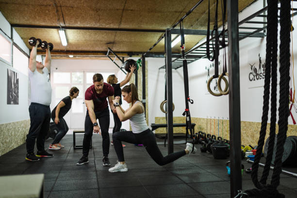istock Exercising in team with professional fitness instructor 1088368806