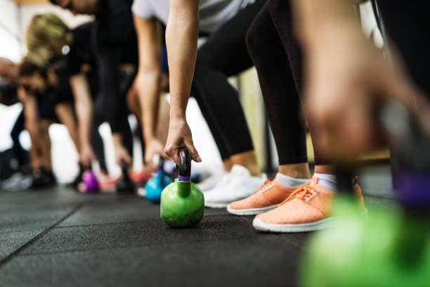 istock Exercising in team with professional fitness instructor 1088368952