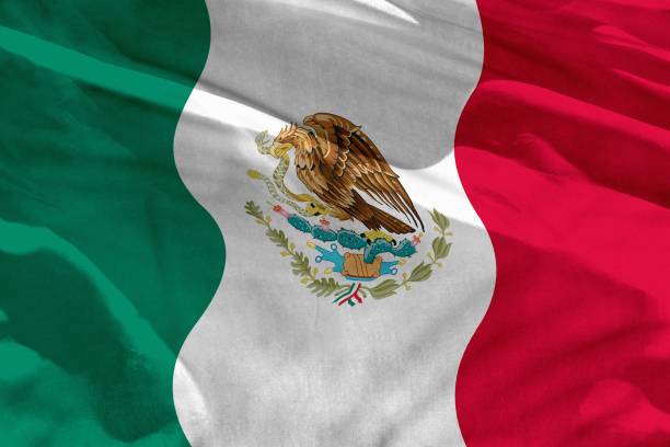 istock Waving Mexico flag for using as texture or background, the flag is fluttering on the wind 1088371140
