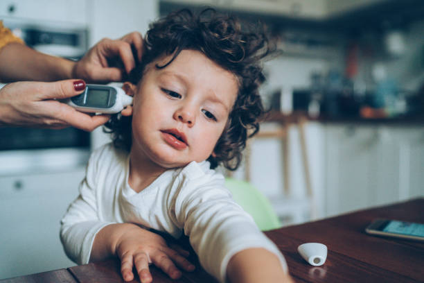 istock Measuring little boy's temperature 1088379548