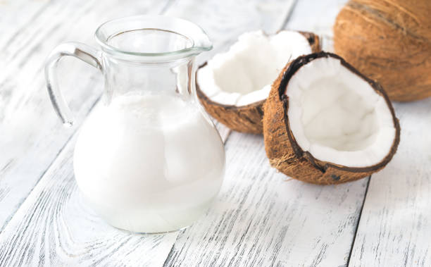 istock Jug of coconut milk with fresh coconut 1088390608