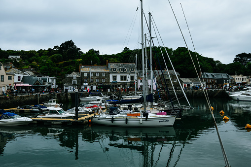 Padstow boat harbour in Cornwall\nFishing boats and yachts mored in dock