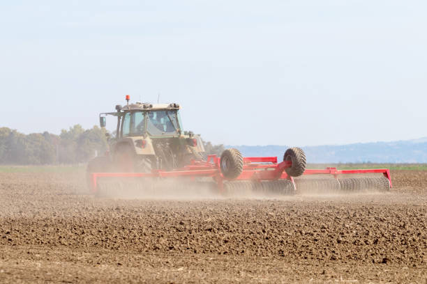 istock Tractor preparing field, Agriculture tractor 1088403350