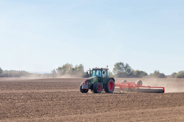istock Tractor preparing field, Agriculture tractor 1088407886