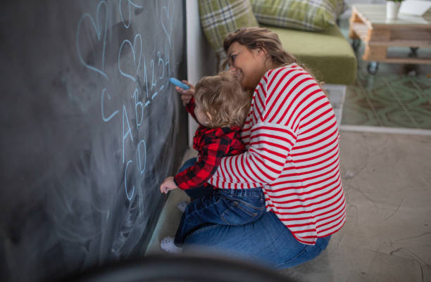 istock mother work´s and play with her child 1088415634