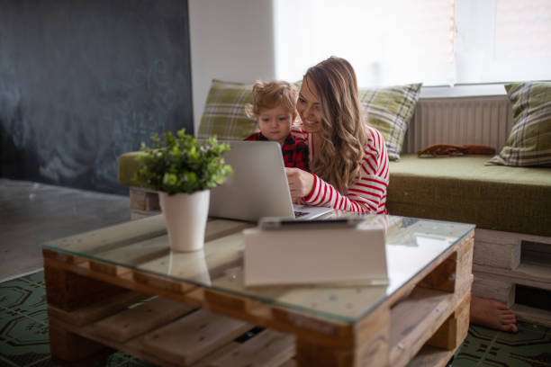 istock mother work´s and play with her child 1088417454