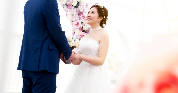 istock Beautiful bride holding husband's hand 1088418984