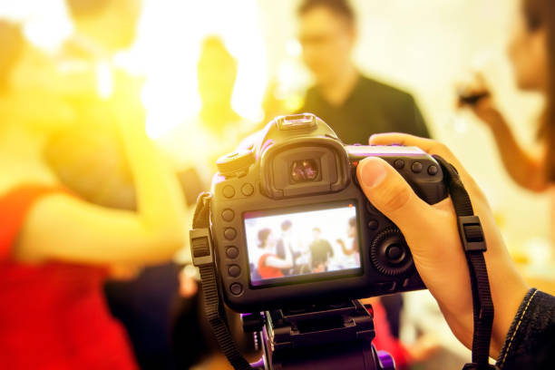 istock SLR camera recording video at wedding party 1088419324