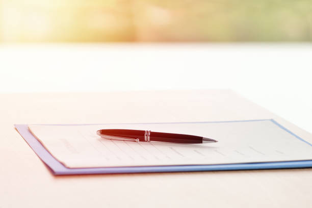 istock test with ballpoint pen over the table with lens flare 1088419336