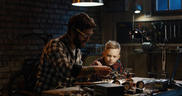 istock Father and son repairing a drone 1088420862
