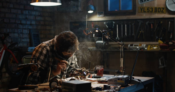 istock Man soldering drone in a garage 1088420894