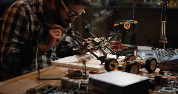 istock Man soldering drone in a garage 1088420958