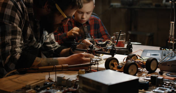 istock Father and son repairing a drone 1088420964
