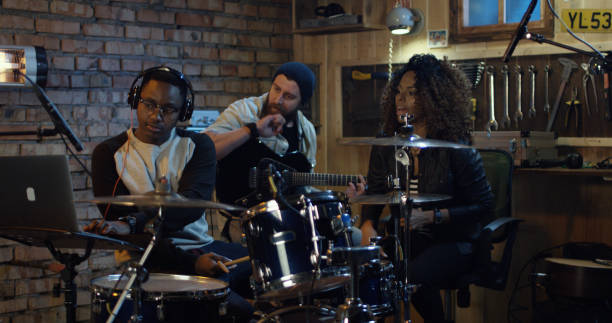 istock Young musicians rehearsing in garage 1088421172