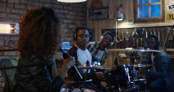 istock Young musicians playing in garage 1088421238