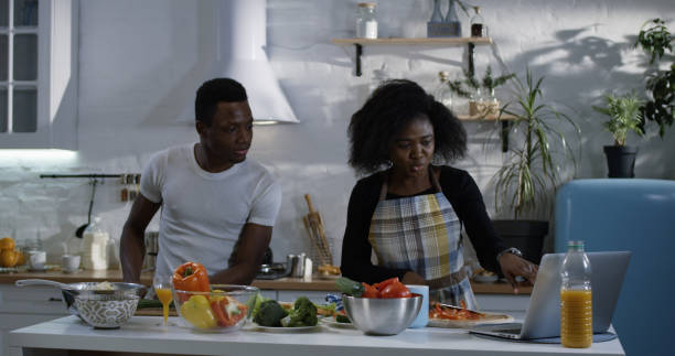 istock Couple preparing food together in the kitchen 1088421306