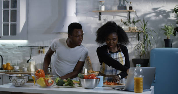 istock Couple preparing food together in the kitchen 1088421320