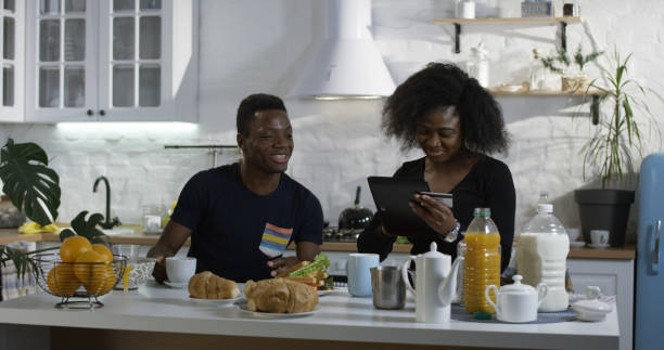 istock Man and woman talking during breakfast 1088421418