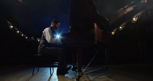 istock Man playing piano on the stage 1088421686