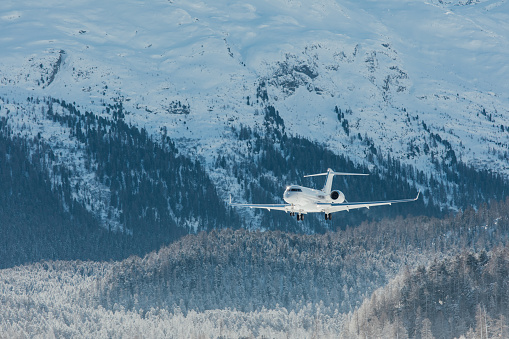Business jet, landing, snow, mountains, white