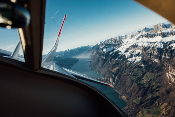 istock Alpine scenery from the air through the airplane window 1088429096