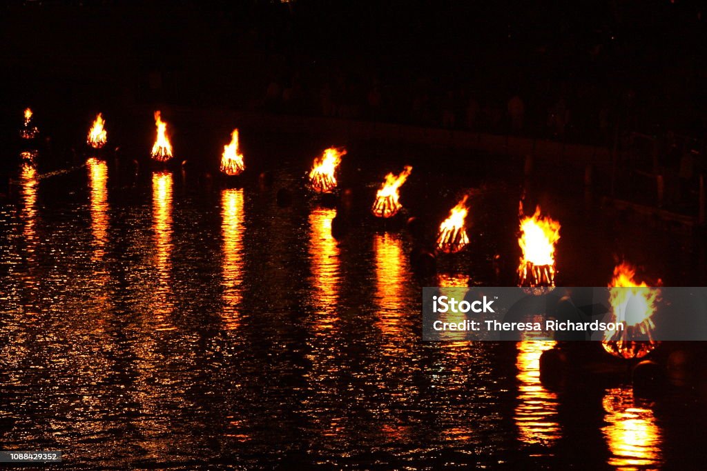 WaterFire Bonfires Curved row of bonfires light up a river at night in Providence, Rhode Island Providence - Rhode Island Stock Photo