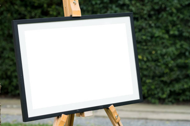 istock Empty wooden frame put in outdoor garden. Modern startup promotion. 1088429372