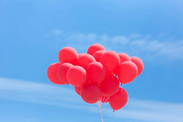 istock balloons red in the blue sky flying isolated 1088431102