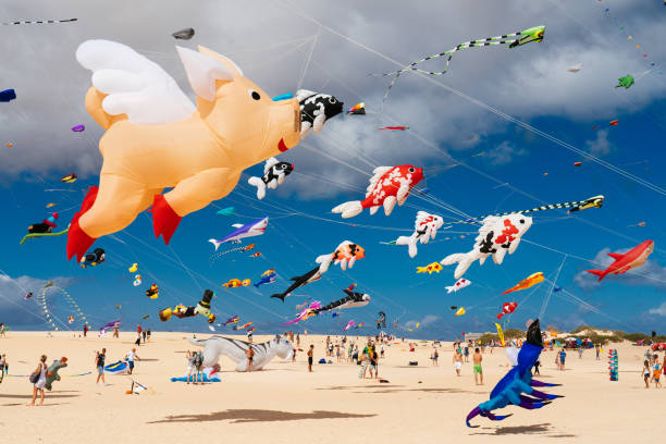 Colorful kites against a blue sky stock photo
