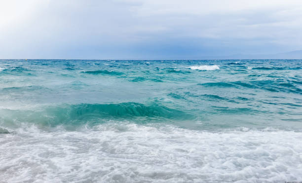 istock Strong waves crash over the beach Beautiful seascape. 1088434676