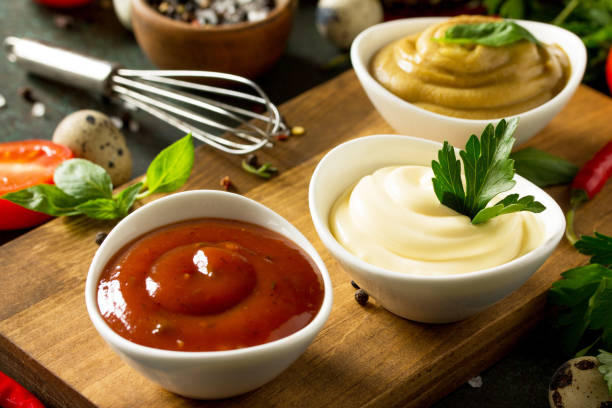 set of sauces. mayonnaise sauce close-up. homemade mayonnaise sauce on the background of stone or concrete. - 15851 imagens e fotografias de stock