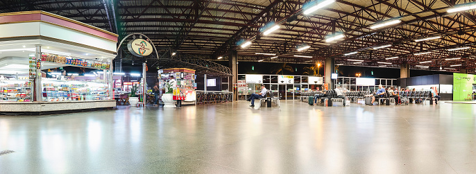 Londrina - PR, Brazil - December 12, 2018: Indoors of the bus terminal called Terminal Rodoviario Jose Garcia Villar (Rodoviaria de Londrina). People waiting for departure.