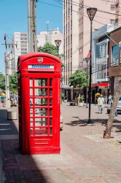 Londrina - PR, Brazil - December 12, 2018: Sercomtel red telephone booth on downtown of the city. Red phone cabin inspired on london's phone booth.