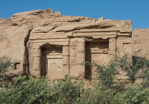 View from the Nile Rive of Gebel el Silsila mountain quarry tombs in Egypt at Khenu near Kom Ombo