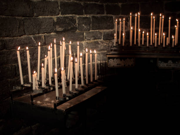 istock Church candles, burning in the dark. Prayers. 1088456356