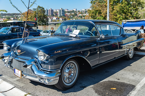 Belgrade, Serbia-October 13, 2018: An oldtimer exhibition in the parking lot in front of the Rakovica Municipality in Belgrade, Serbia. Cadillac DeVille 1957 a vintage limousine.