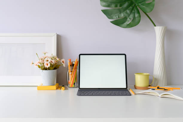 istock Workspace mockup tablet and office supplies on office desk. 1088462684