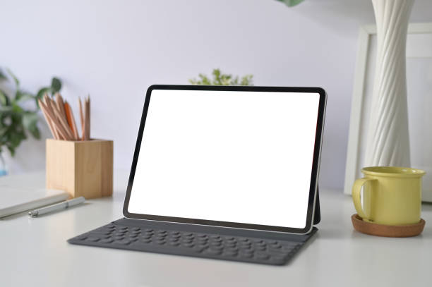 istock Workspace office table with mockup tablet and office supplies on office desk. 1088462932