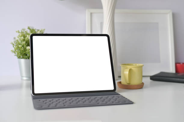 istock Workspace office table with mockup tablet and office supplies on office desk. 1088462938