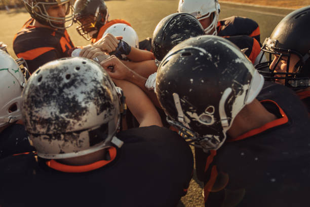 istock Football Players Huddling 1088462972