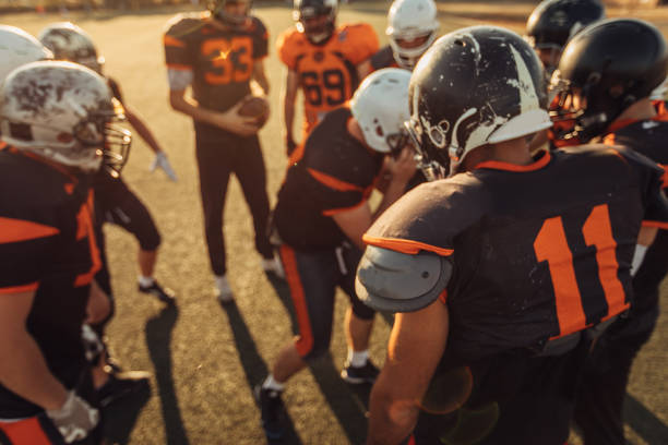 istock Football Players Huddling 1088463486