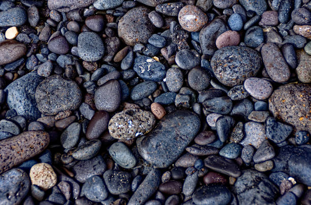 istock Black stones on the beach 1088465476