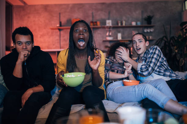 istock Multi-ethnic friends watching TV 1088466946