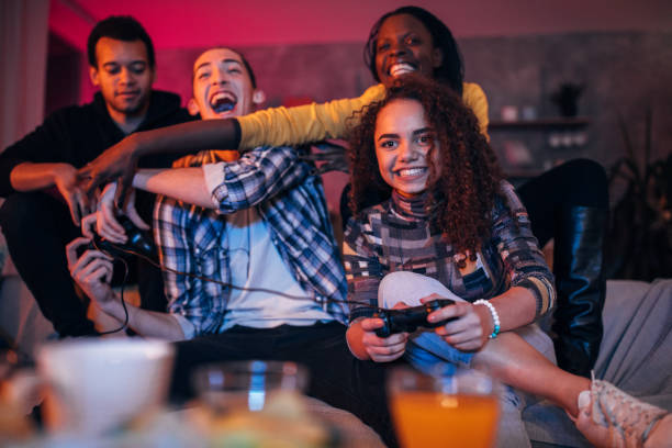 istock Group of friends playing video games 1088467190
