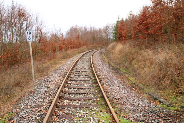 istock Railway tracks run in a curve away from the viewer. 1088481524