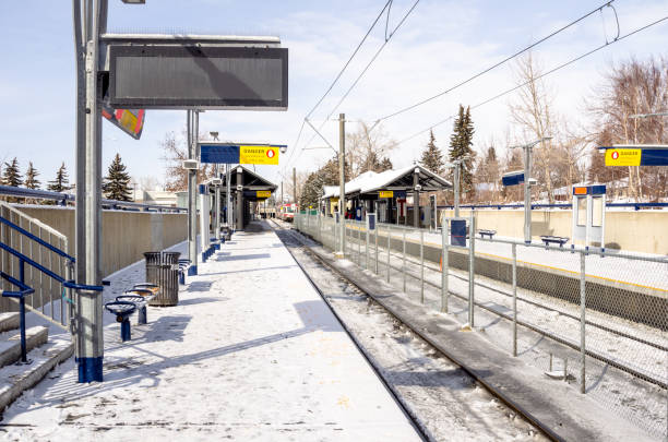istock Empty Platform Covered in Snow at a Light Rail Station on a Sunny Winter Day 1088481570
