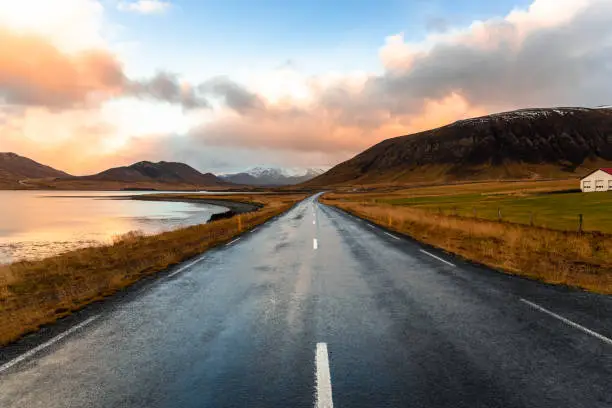 Photo of Straight Stretch of a Coast Road in Iceland at Sunset