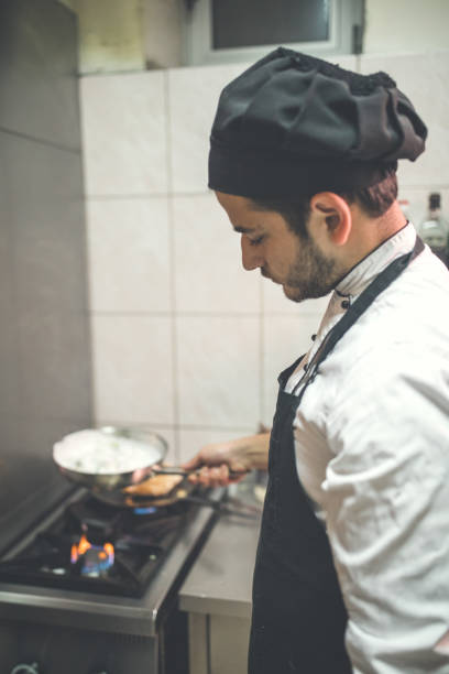 istock Male chef preparing food in kitchen 1088483084