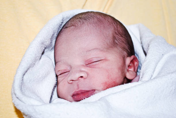 istock New-born baby wrapped in blanket 1088490028